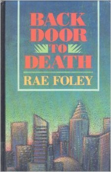 This is a paperback of the alternative title to this novel, Backdoor to Death. It has a city scape scene. 